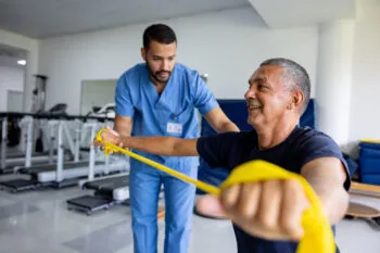 A physio doing physical therapy with a patient